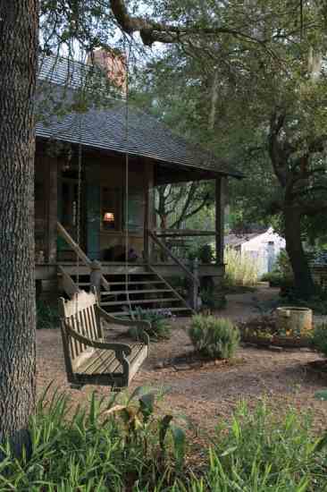 The kitchen porch leads to the garden for easy access to culinary herbs—or for daydreaming in the swing.